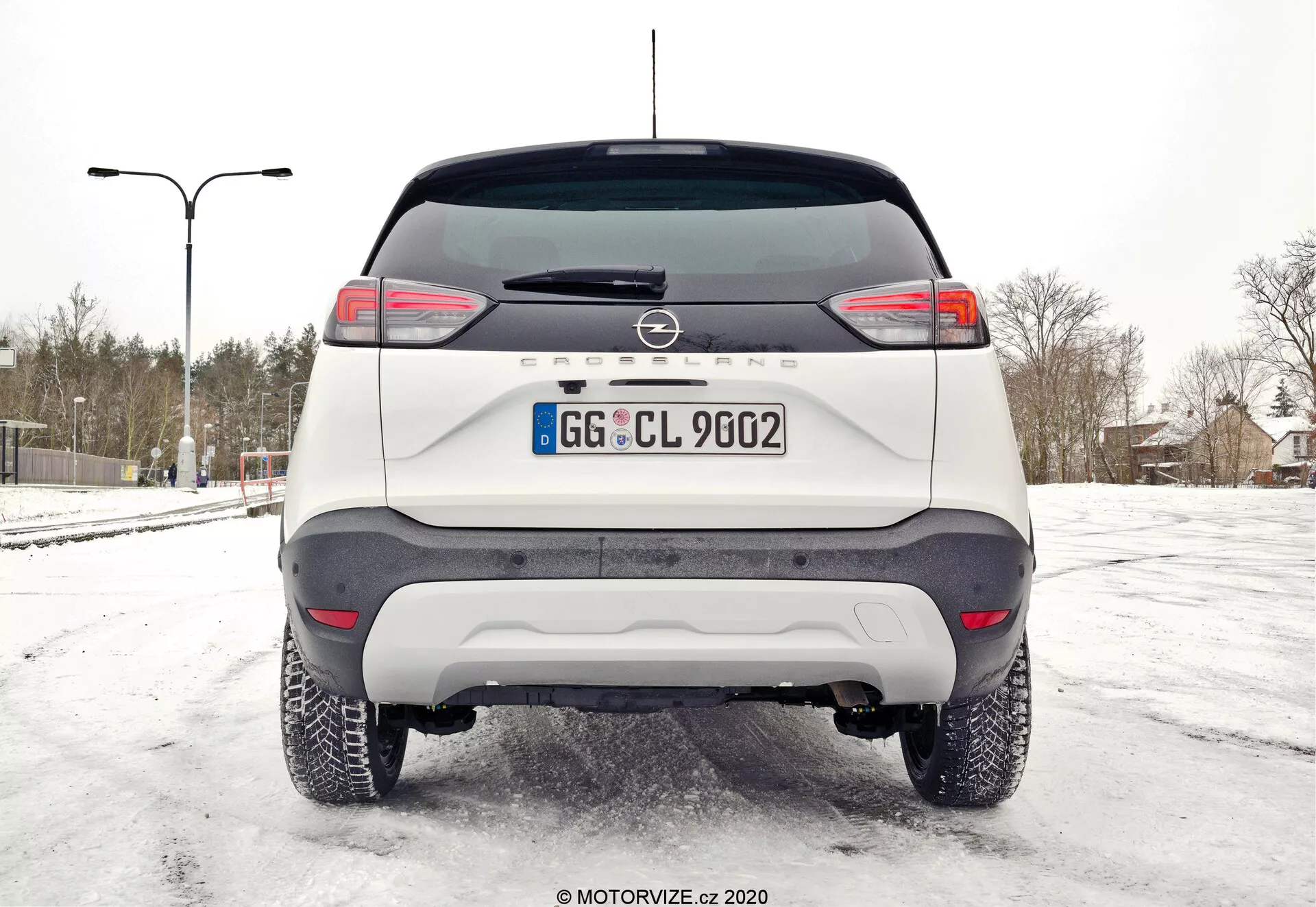 2021 Opel Crossland 1.2 side view in a striking urban setting, showcasing its sleek design and modern features