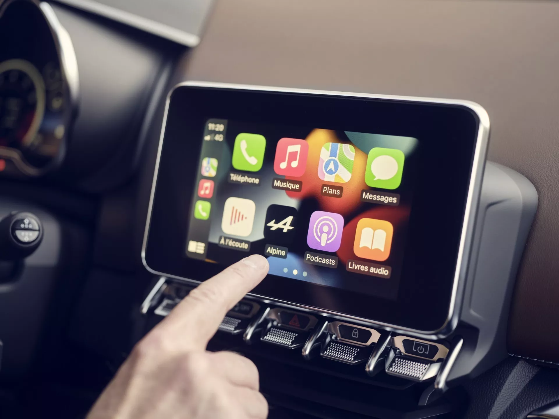 Modern Alpine A110 2017 infotainment system with touchscreen display and manual controls integration, featuring smartphone compatibility apps