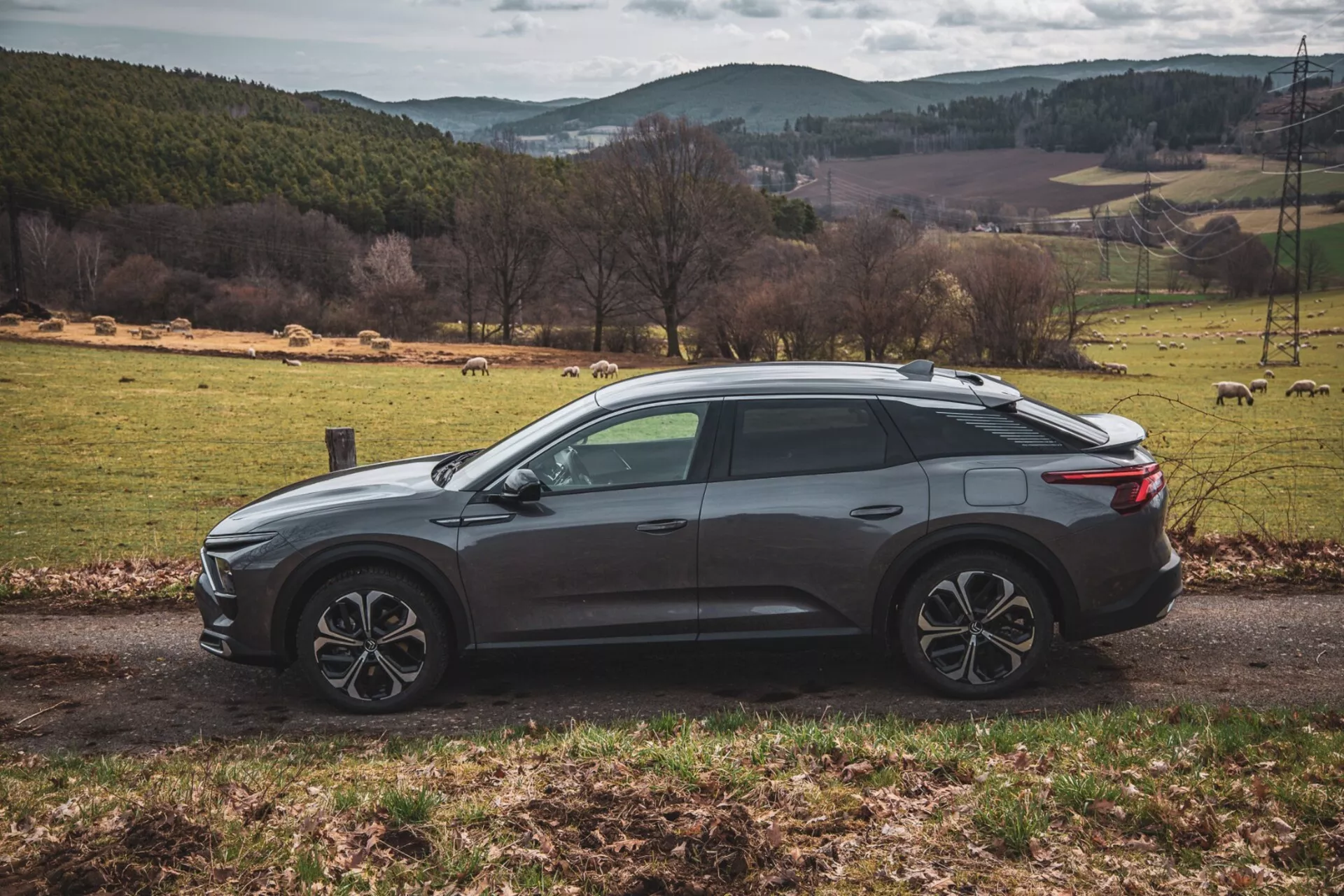2022 Citroen C5-X in a sleek silver color, showcasing its innovative design and technological features on a clear day