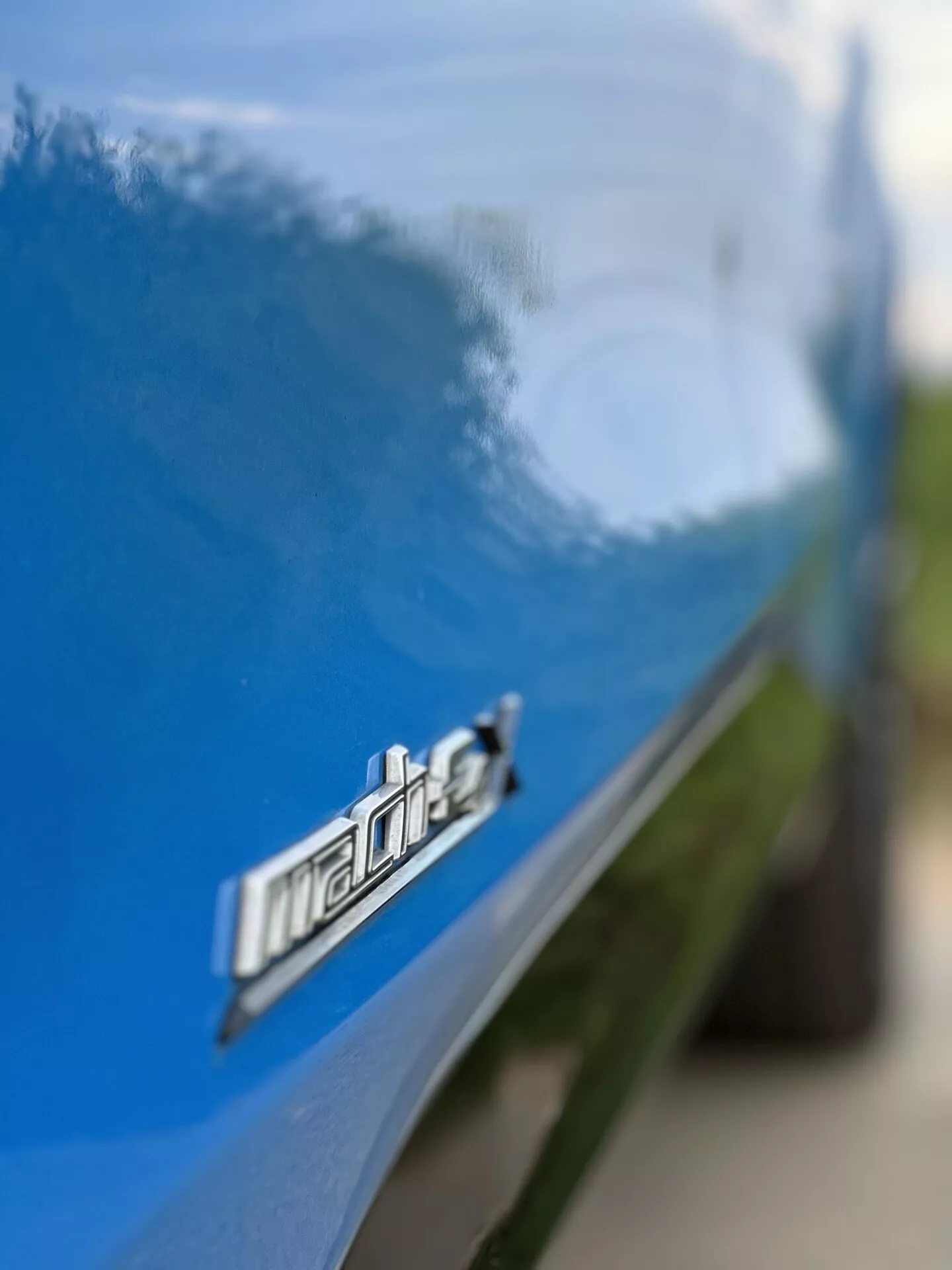 2020 Ford Mustang Mach-E electric SUV in dynamic driving scene showcasing its sleek design and modern features