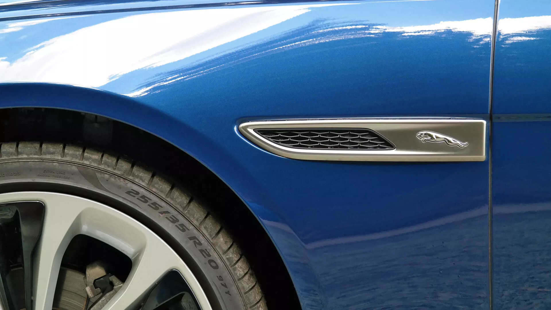 2021 Jaguar XF - Luxurious white sedan with sleek lines, LED headlights, advanced aerodynamics, premium leather interior, and cutting-edge technology