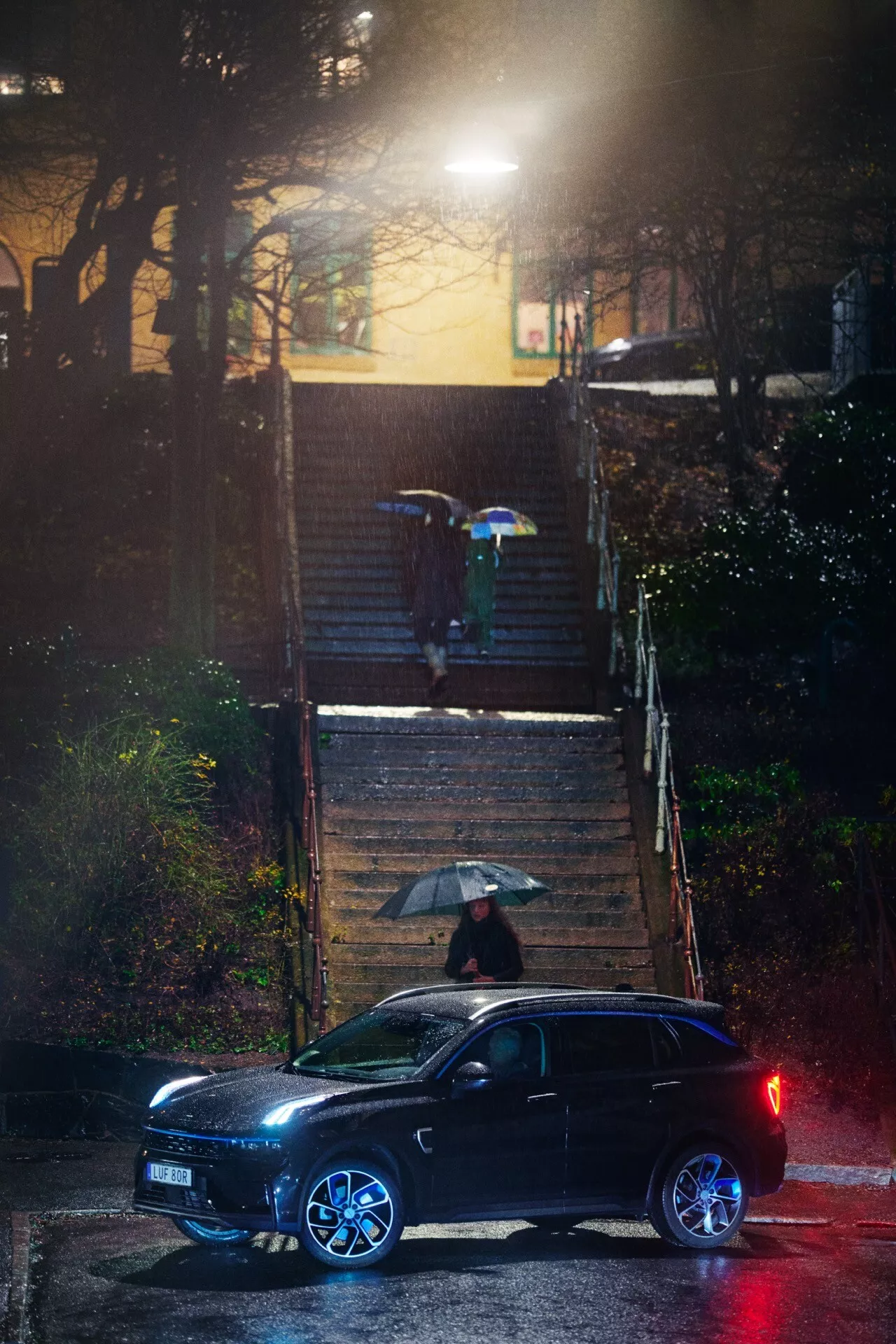 2021 Lynk & Co 01 first generation compact SUV in dynamic drive posture on urban road