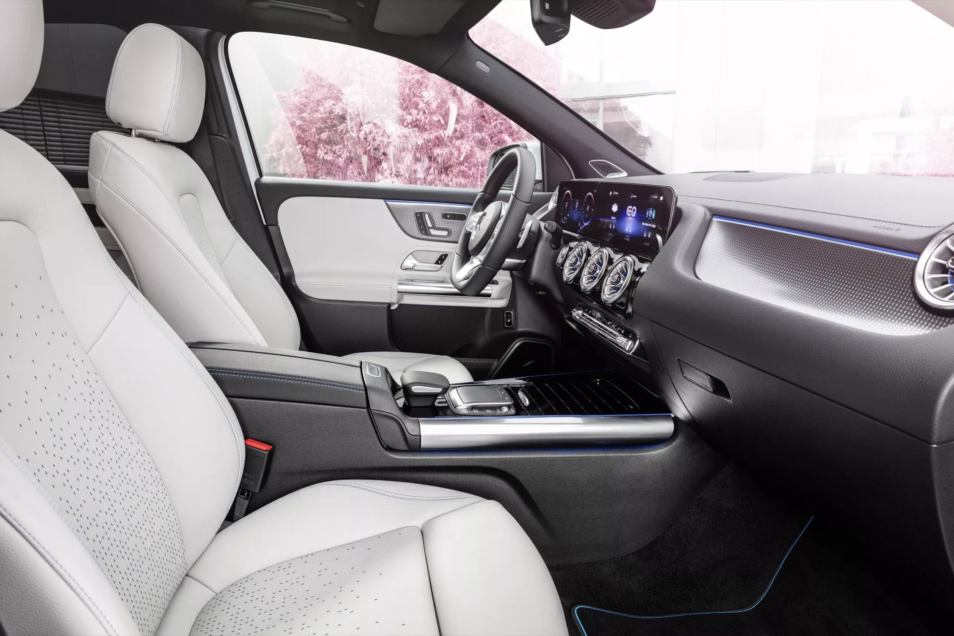 Interior view of the Mercedes-Benz EQA 2021 featuring the dashboard, center console, and steering wheel, highlighting modern car technology and luxury design