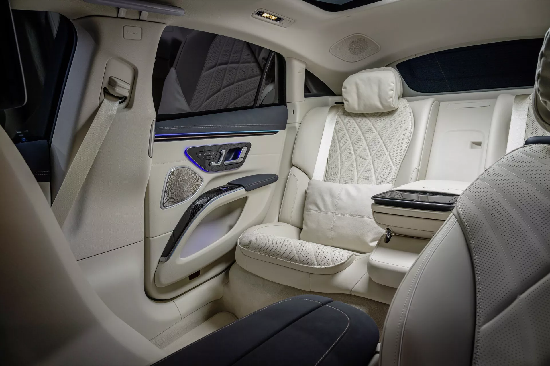 Interior view of the 2024 Mercedes-Benz EQS 297 facelift showcasing premium leather seats with quilted design, two-tone color scheme, and high-end features from a diagonal angle