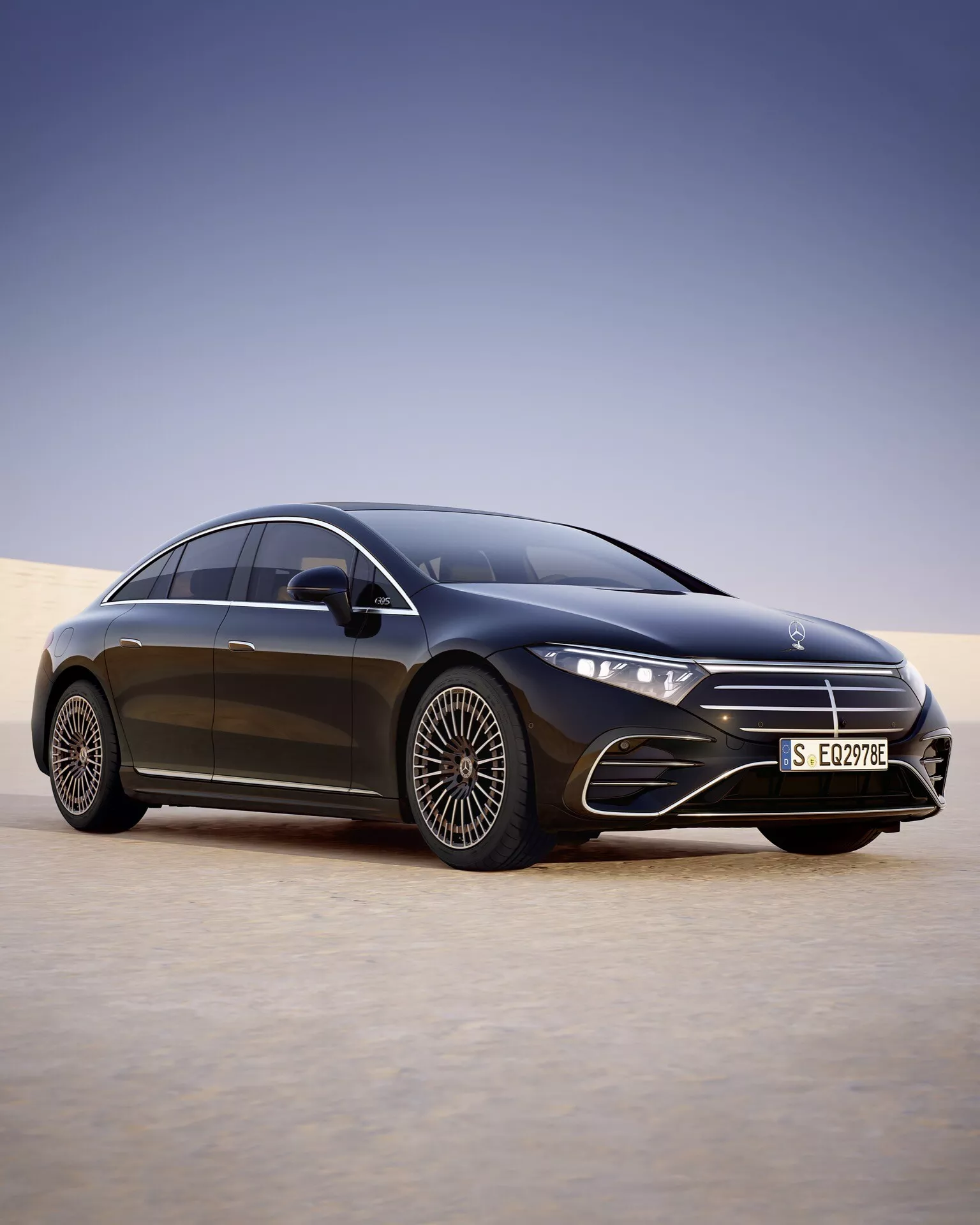 2024 Mercedes-Benz EQS facelift model in a desert environment showcasing LED headlights, large alloy wheels, and advanced aerodynamics