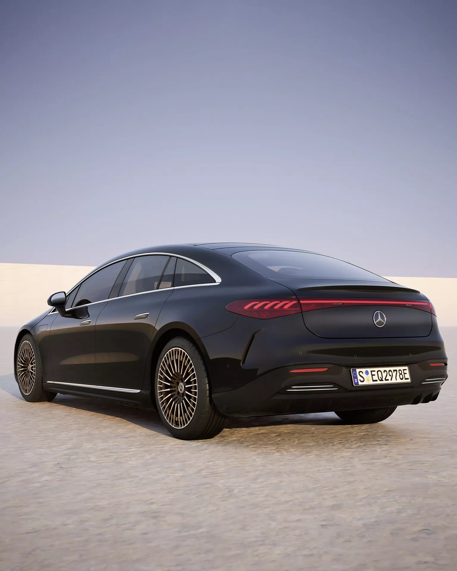 2024 Mercedes-Benz EQS 297 facelift captured in a rear three-quarter view, showcasing LED tail lights, sleek black aerodynamic body, electric badge, and performance alloy wheels against a dusk-toned gradient background