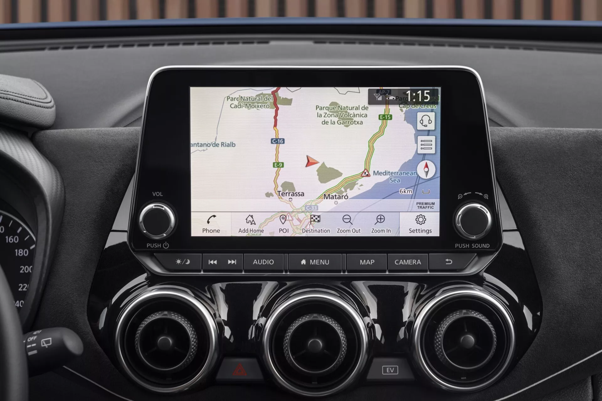 Close-up of 2019 Nissan Juke F16 infotainment display and central dashboard featuring GPS navigation, phone connectivity, air vents, and control buttons for advanced technology and convenience