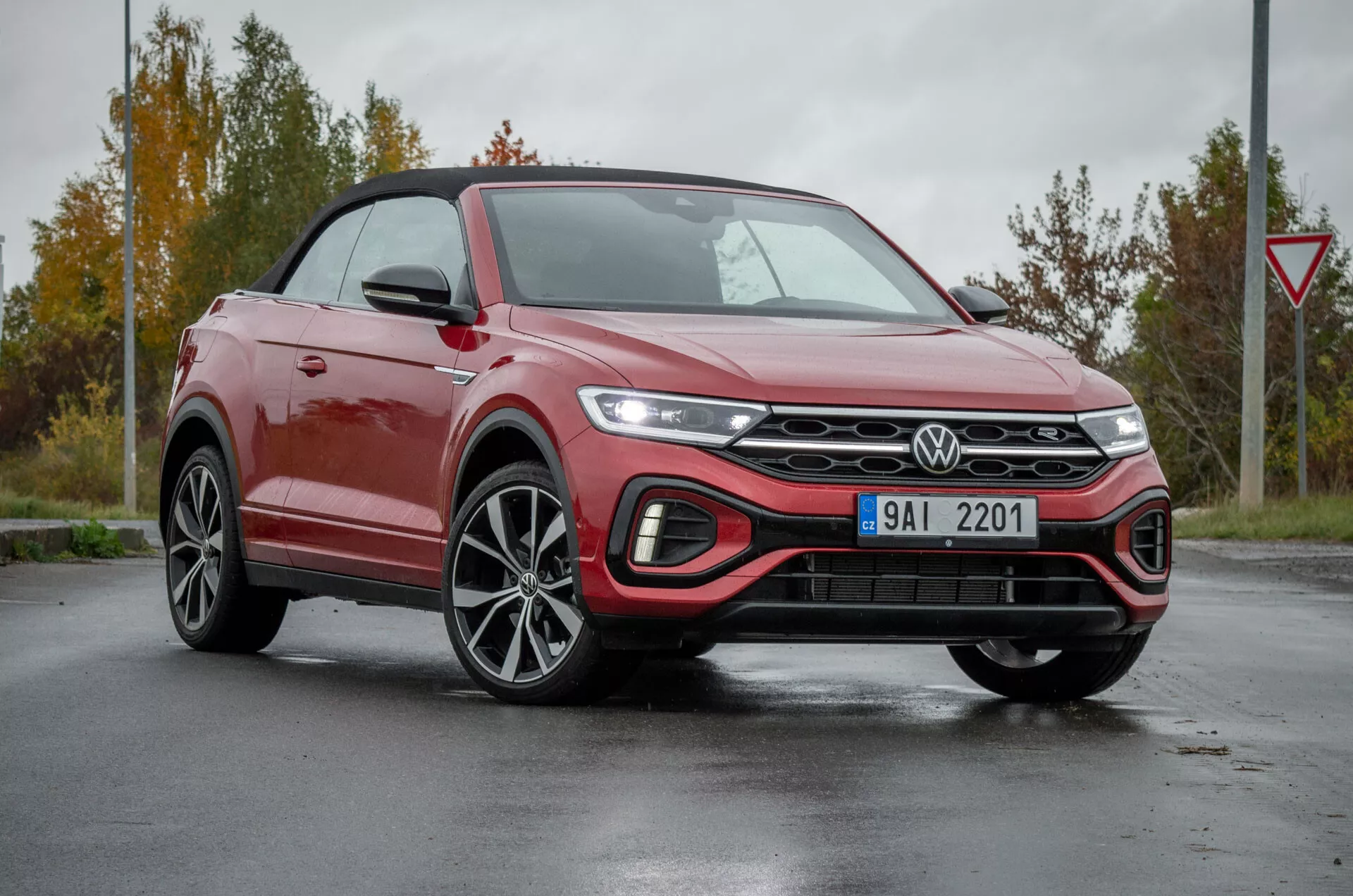 2022 VW T-Roc Cabriolet in a front three-quarter view highlighting its modern convertible crossover SUV design, including sleek LED headlights, advanced grille cooling system, sporty alloy wheels, and technological features under diffused daylight